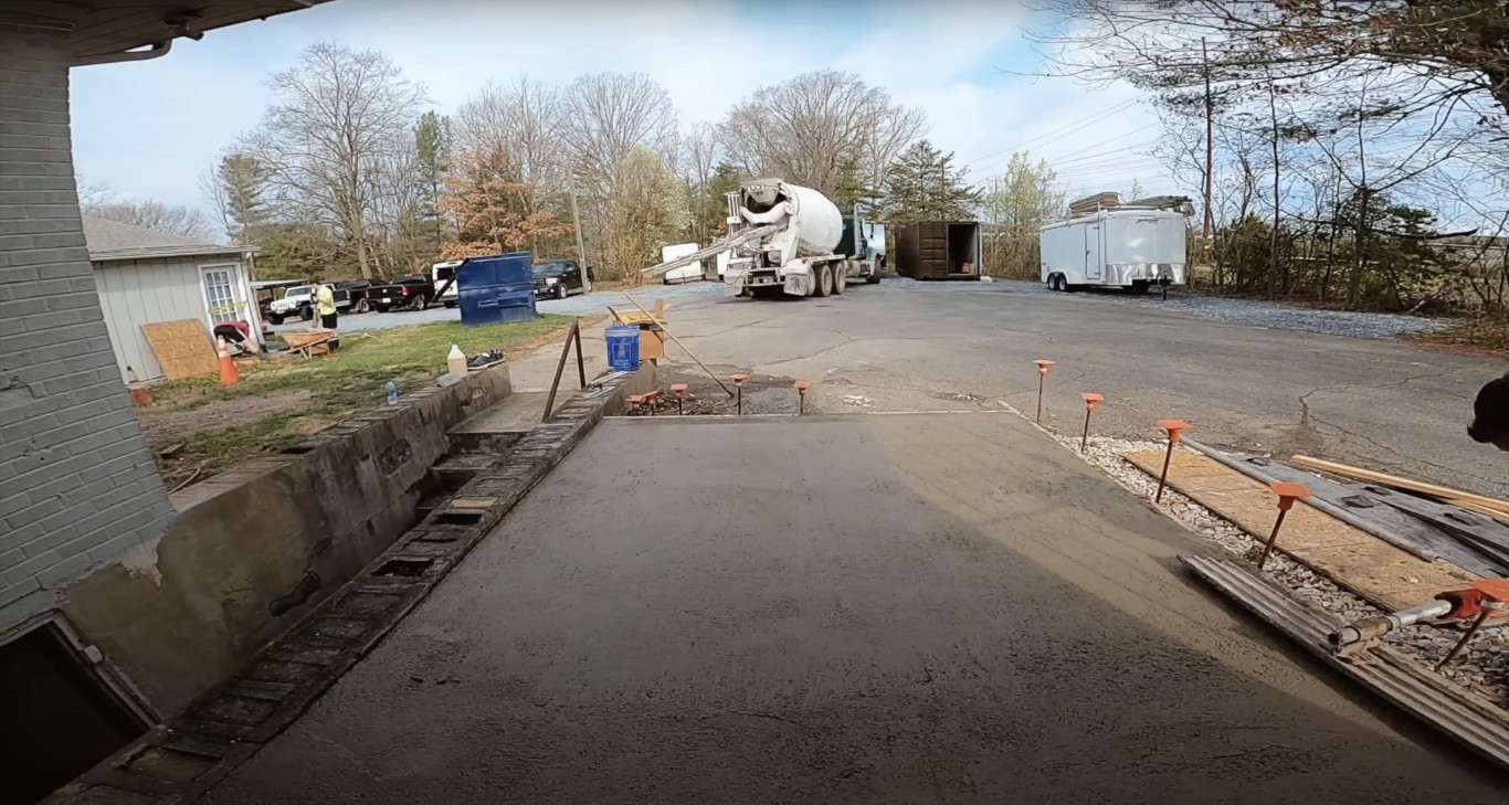 Professional concrete contractor pouring driveway in Newton MA