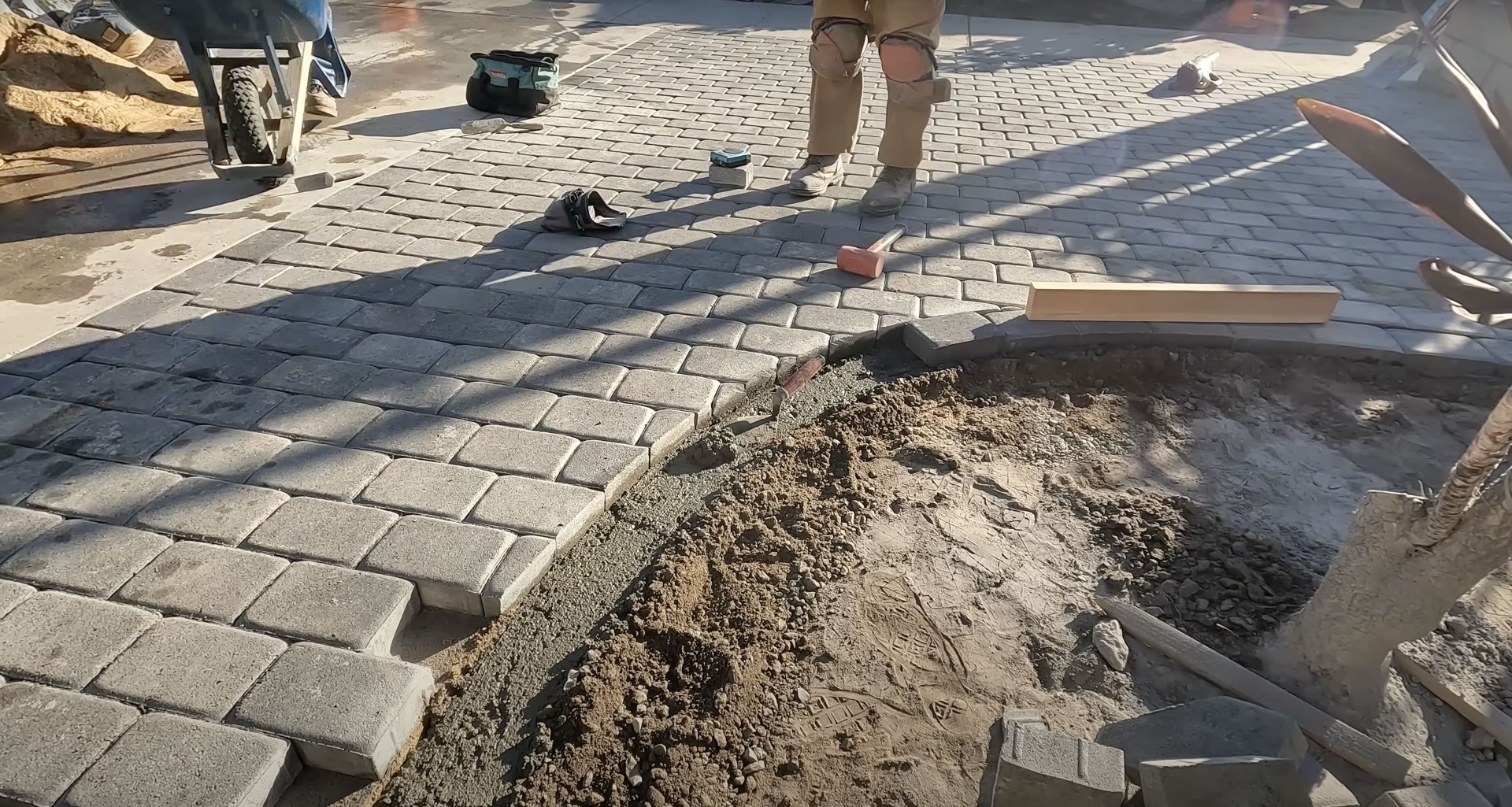 Professional concrete workers installing new patio